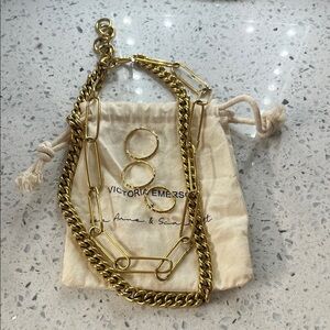 Victoria Emerson Gold Chain Necklace with three varied size rings